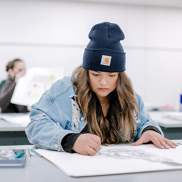 woman drawing in an art class