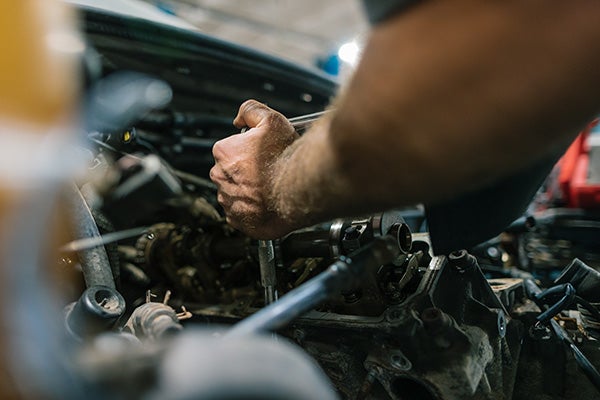 Man working on an engine block