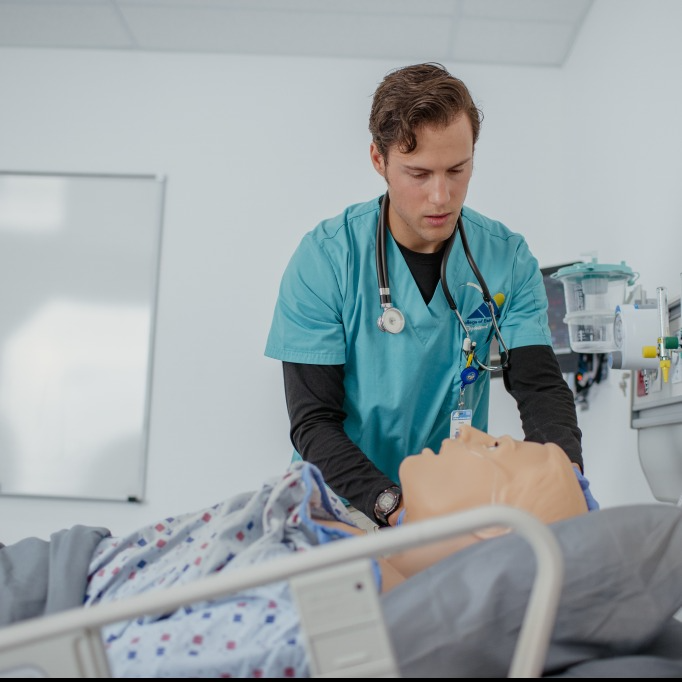 Nurse working on a dummy patient