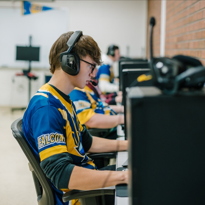 Student member of the esports team playing a game