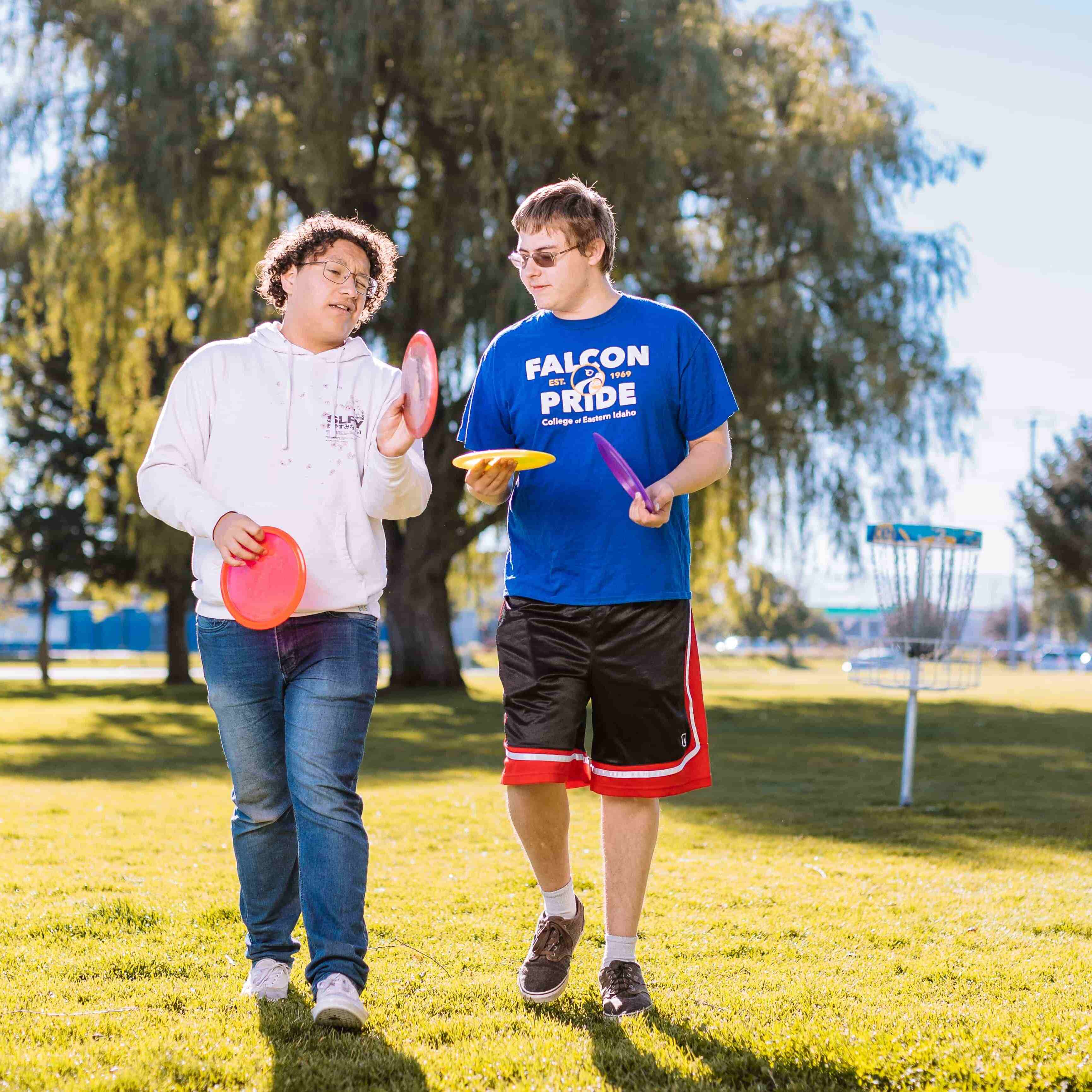 Students playing frisbee golf