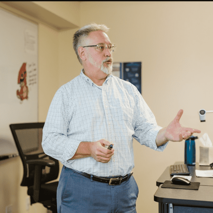 Man lecturing in a classroom