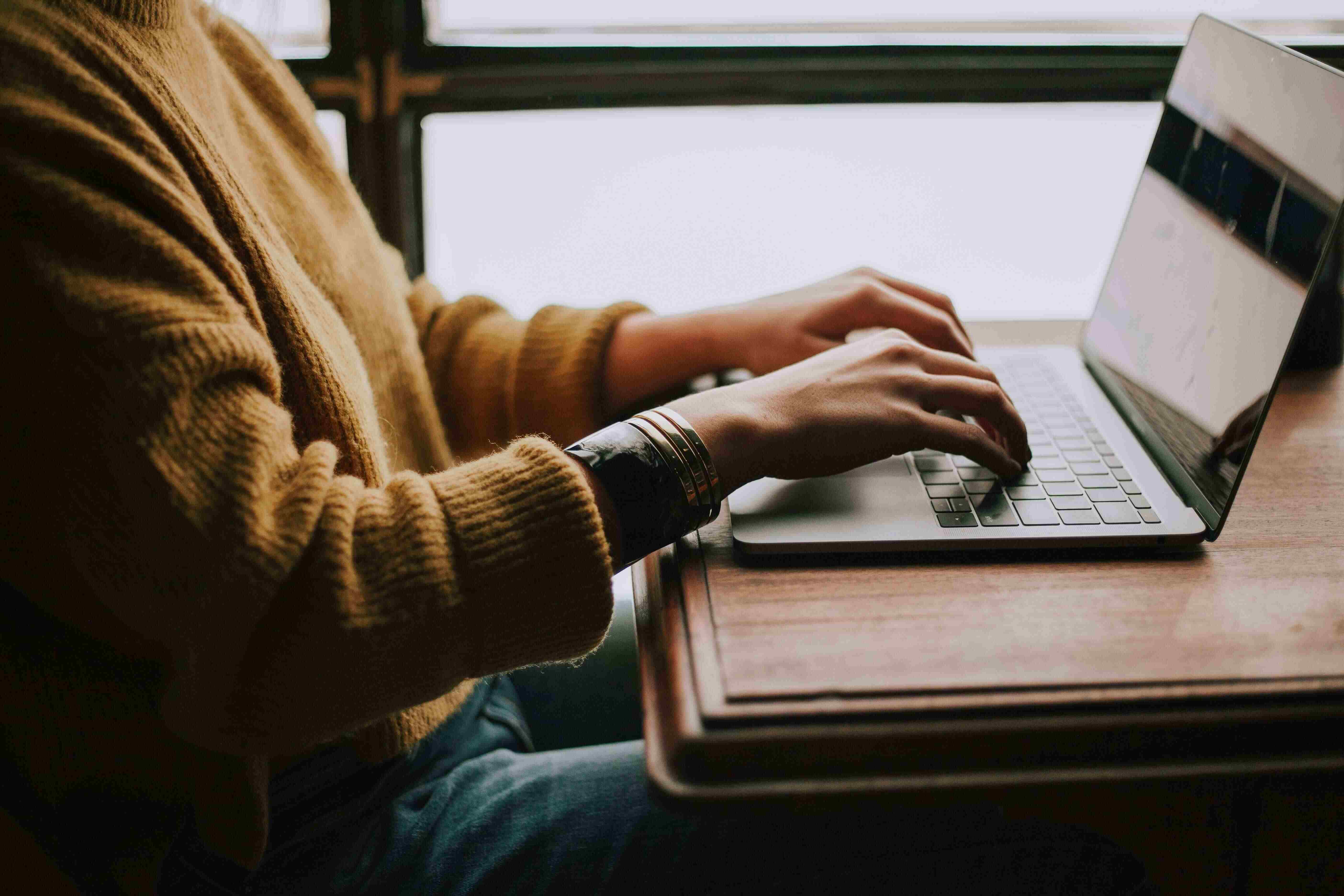 Person typing on a laptop
