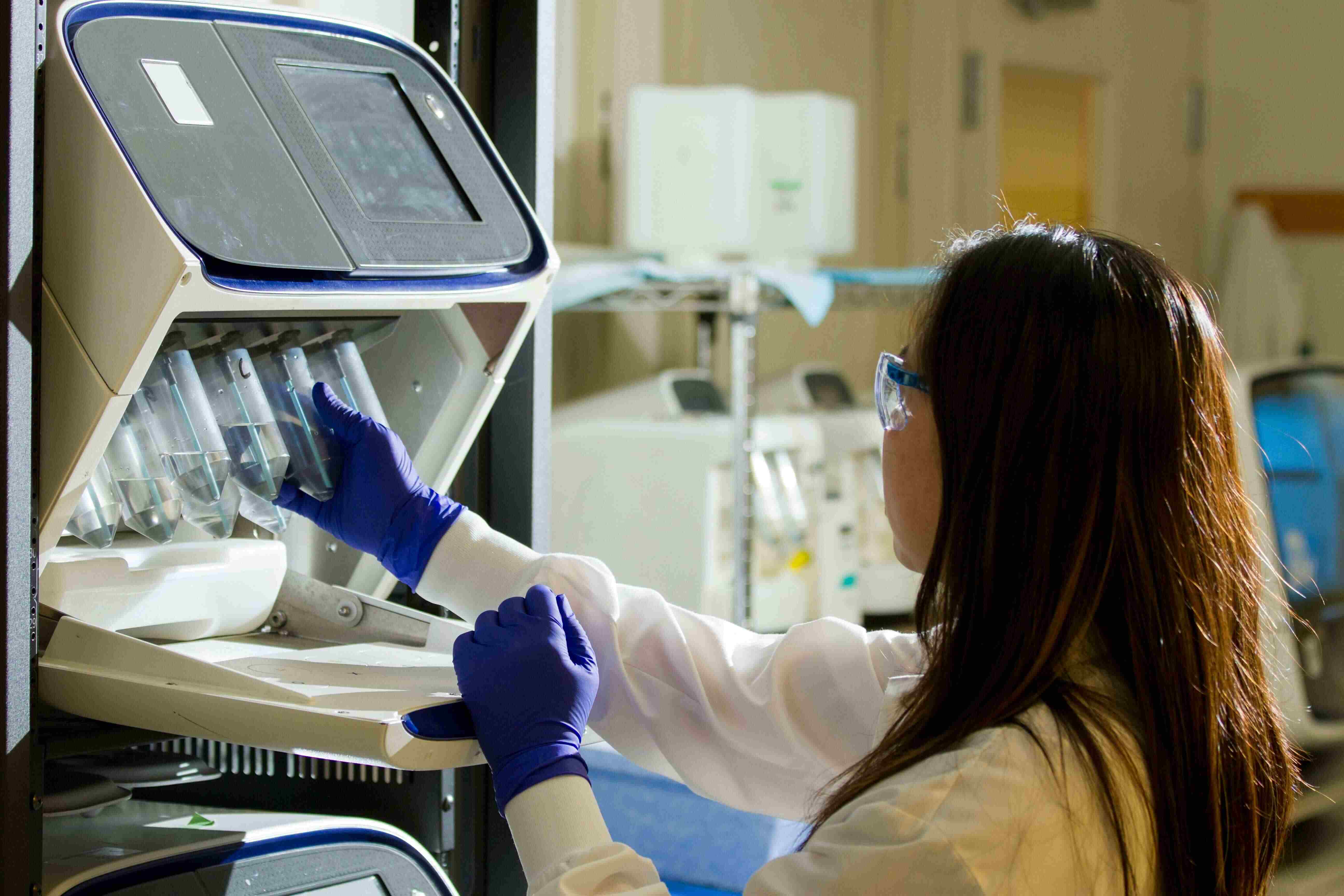 Female researcher working on scientific equipment