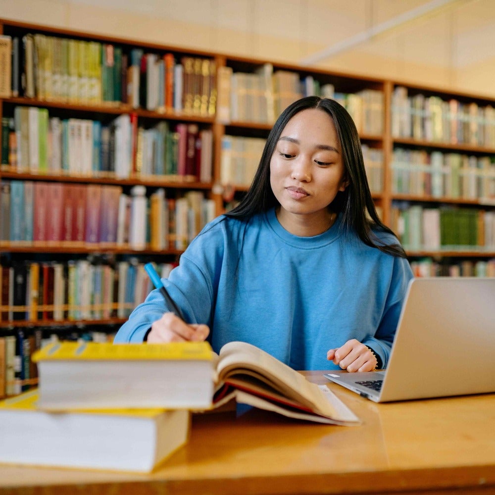 Student learner at a library