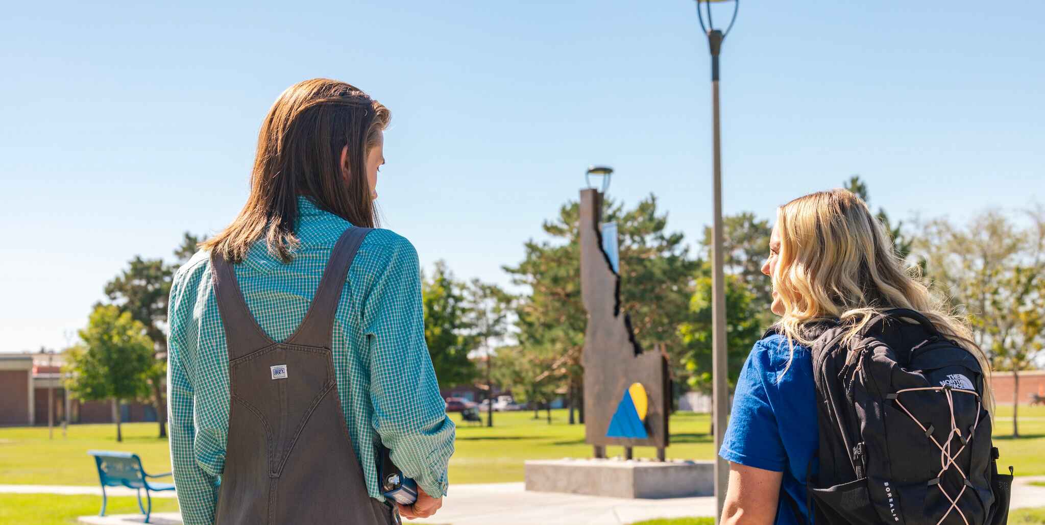 Two CEI students walking on campus