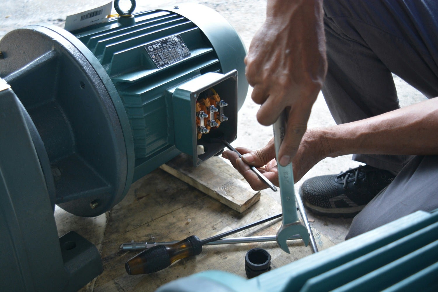 Stock image of person working on electric motor