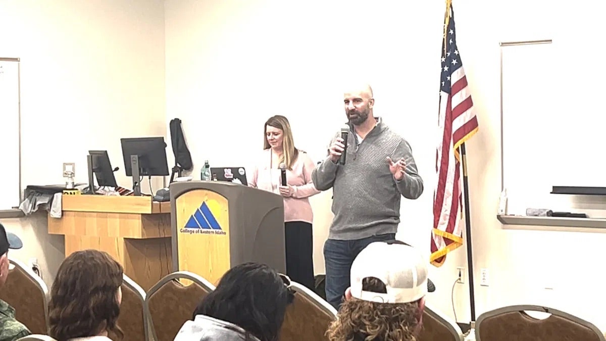 Photo of Dylan Rounds giving a speech