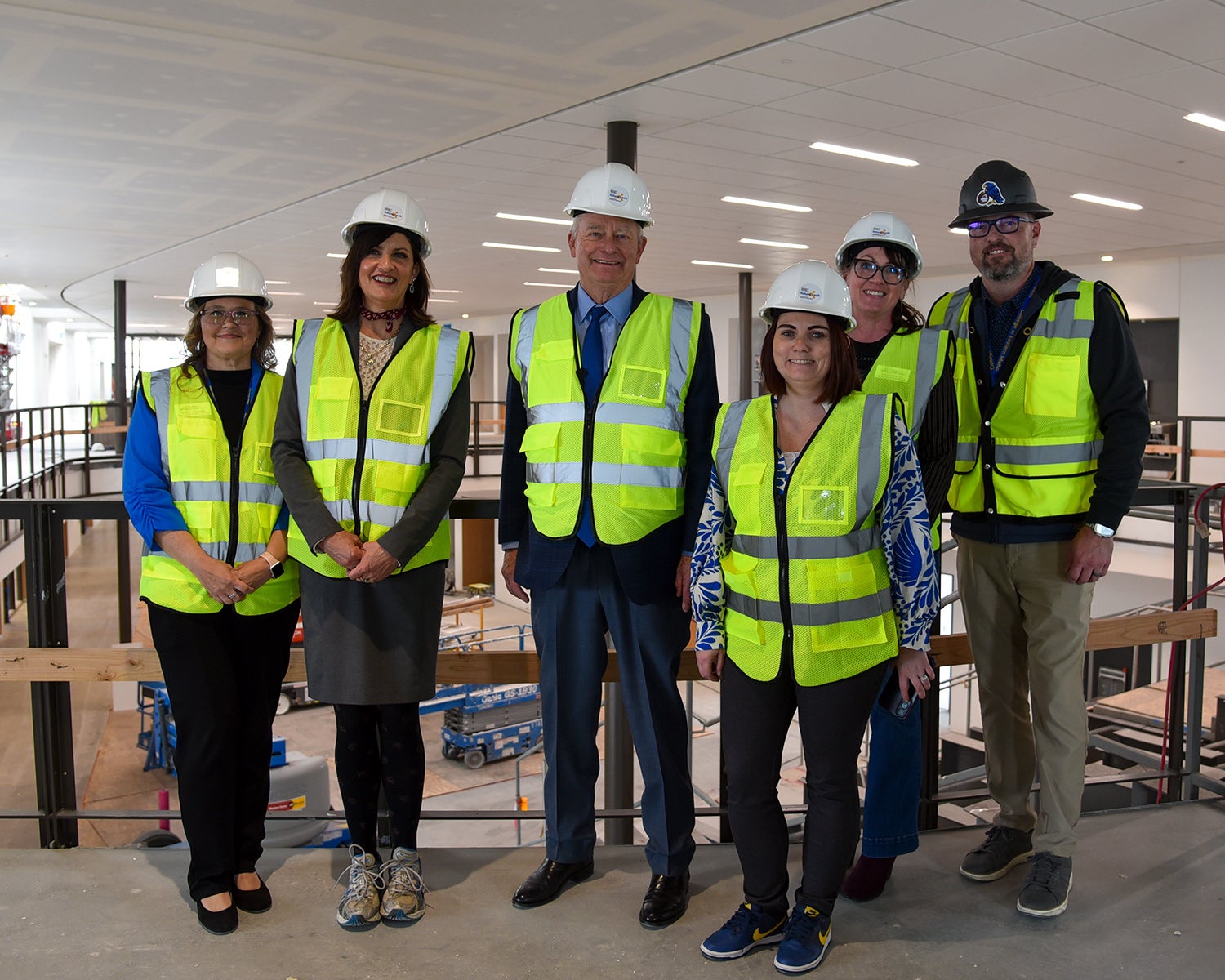 Governor Brad Little group photo with President Lori Barber and construction workers