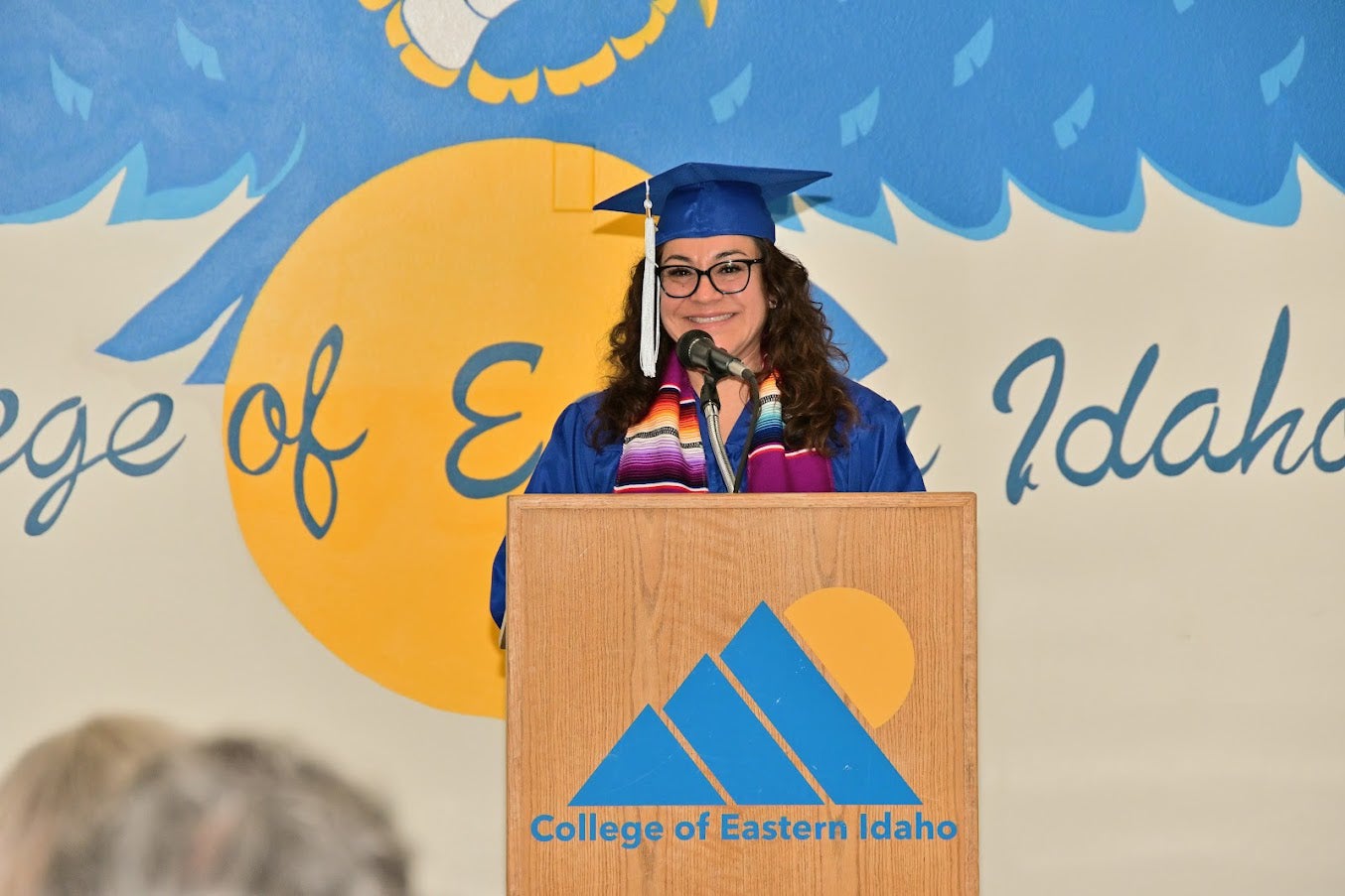 Graduating class member speaking at the pulpit