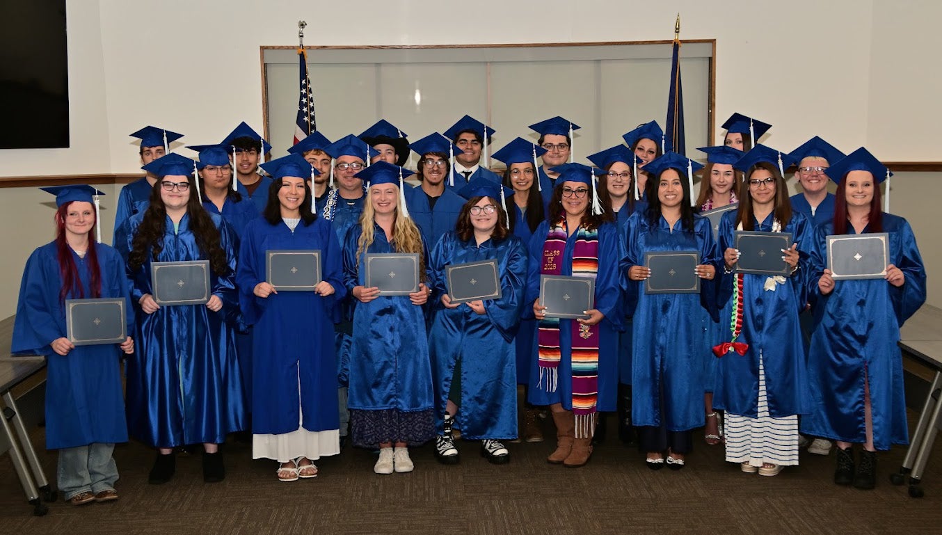 Graduated class with diplomas