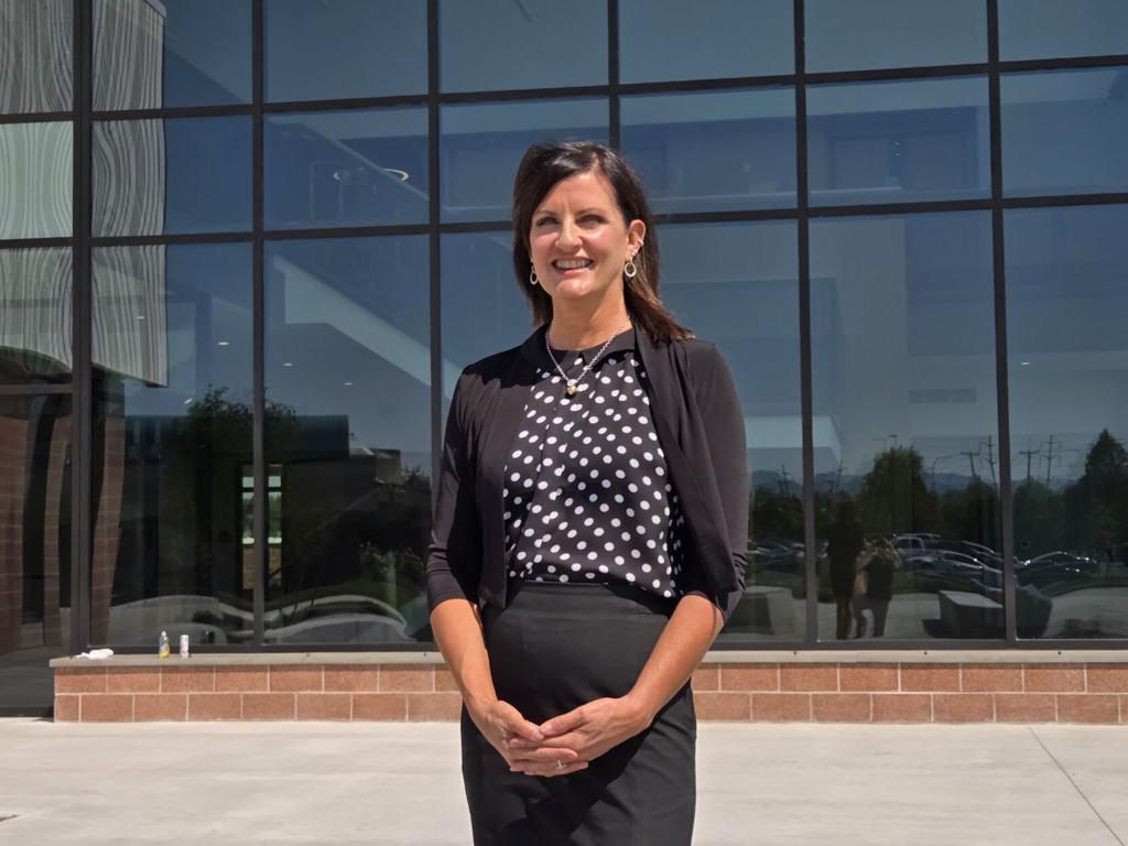 Lori Barber in front of the new building