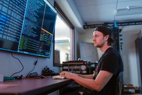 Cybersecurity officer working at a computer
