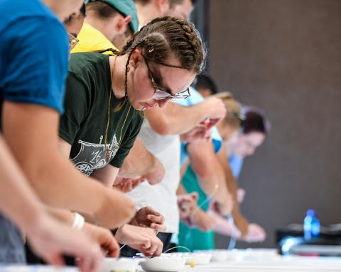 Participants of a challenge interacting with their materials