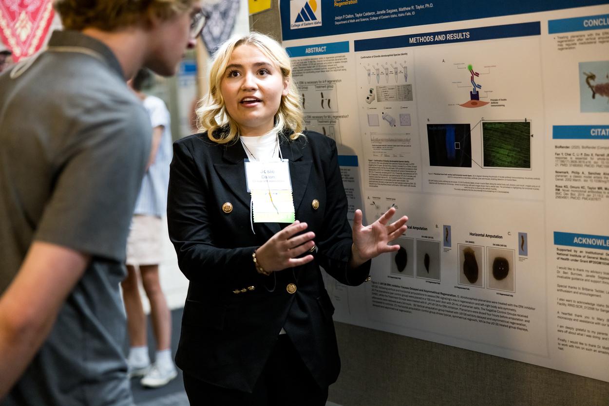 Student giving demonstration to an onlooker