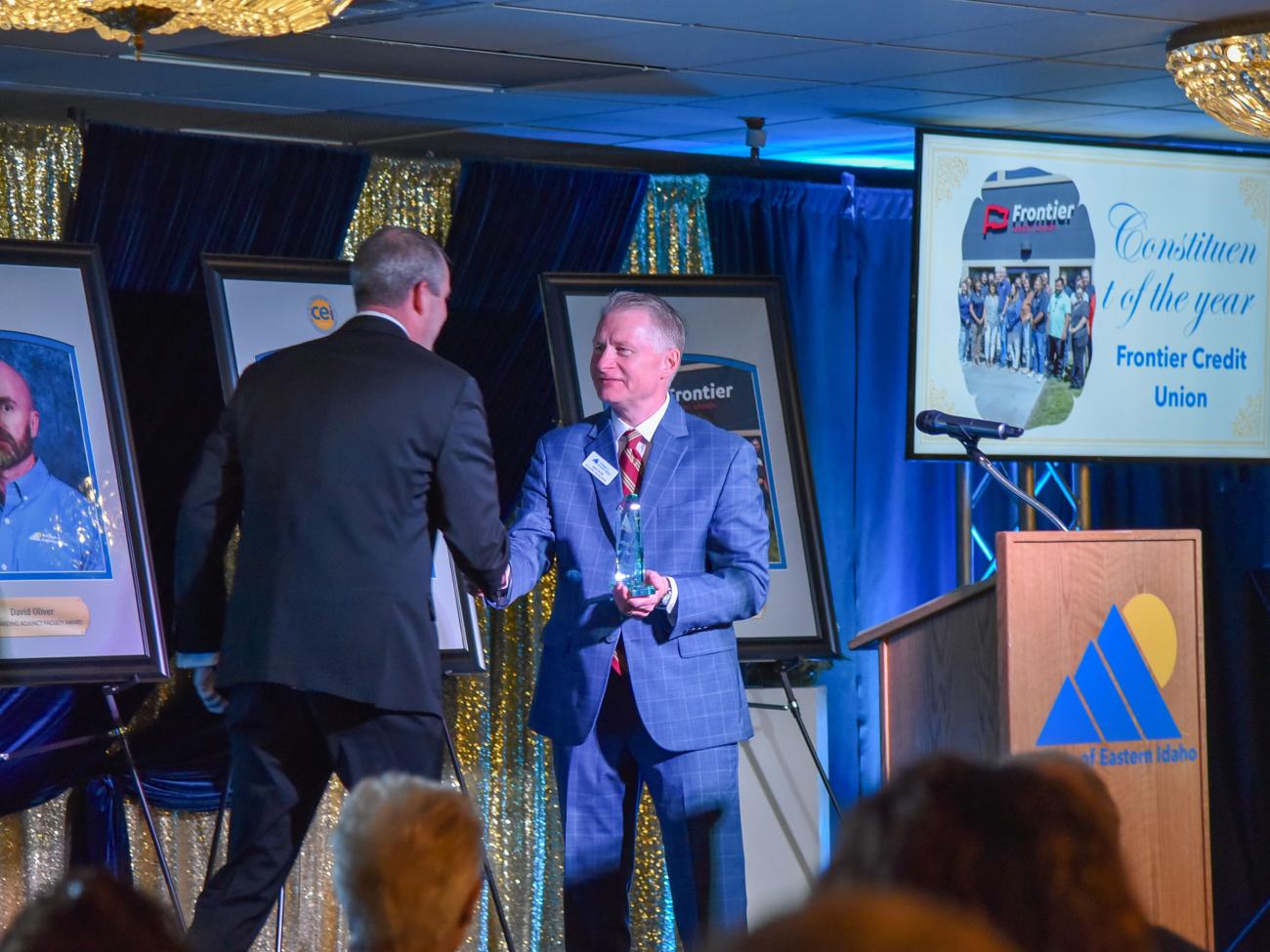 Dan Thurman, CEO of Frontier Credit Union, accepts the Constituent of the Year award from CEI Foundation Executive Director Dave Facer.
