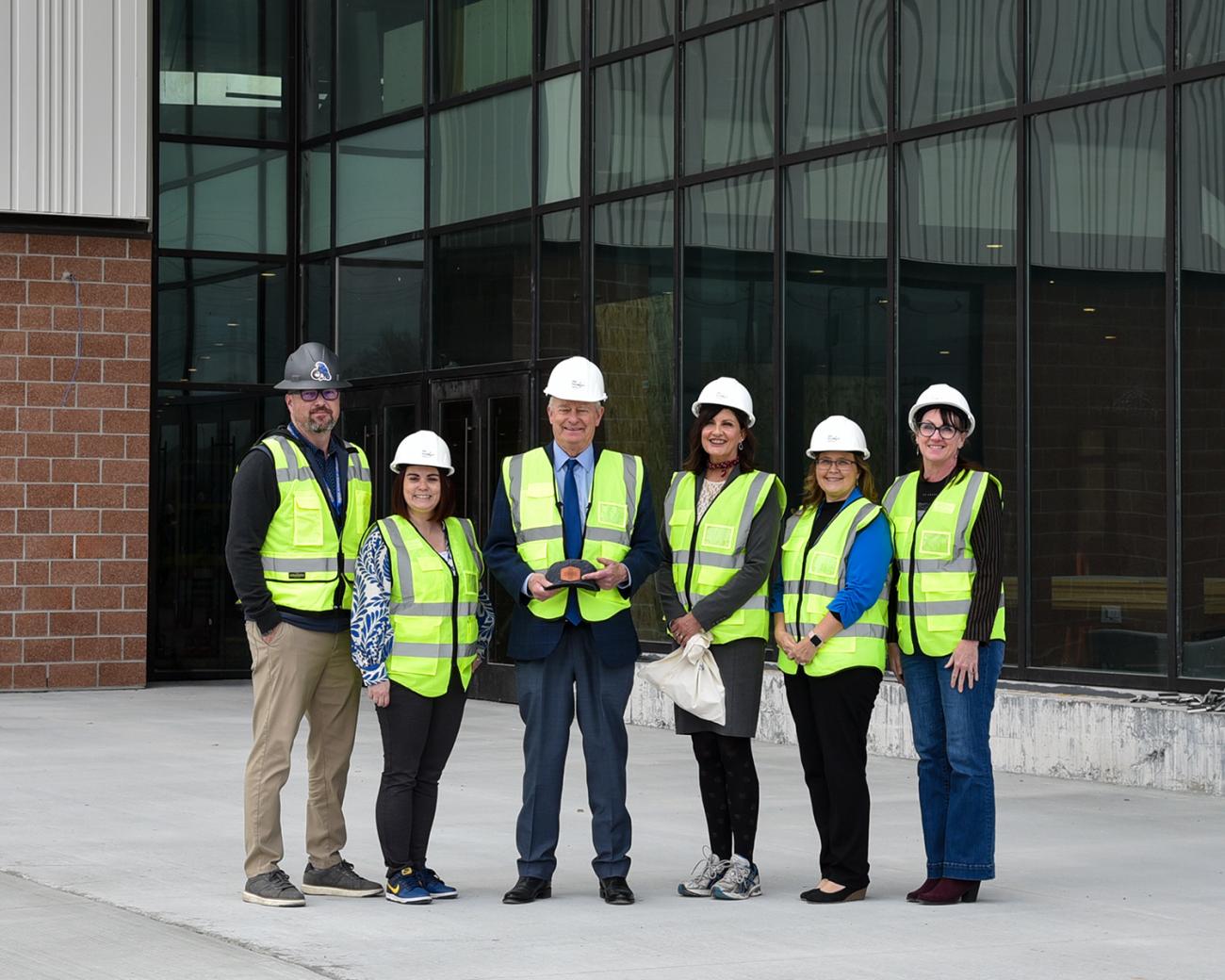 Governor Brad Little joins College of Eastern Idaho leadership in front of the Battelle Energy Alliance Future Tech Building in partnership with Frontier Credit Union during his April 28 visit to campus.