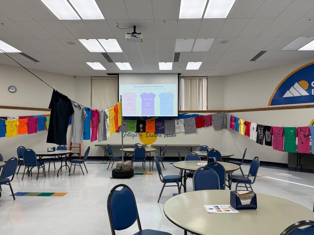 Shirts bearing personal messages and artwork hang in the CEI Cafeteria during the sixth annual Clothesline Project honoring survivors of violence and remembering those lost.