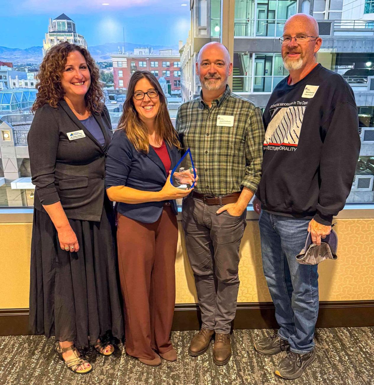 From left: Angela Sackett, Vice President of Academic & Student Affairs; Heidi Tighe, Written Communication instructor and recipient of the Idaho GEM Innovative Educator Award in Written Communication; Jacob Haeberle, Dean of General and Transfer Education; and Steve Harrison, Department Chair of Oral and Written Communication.
