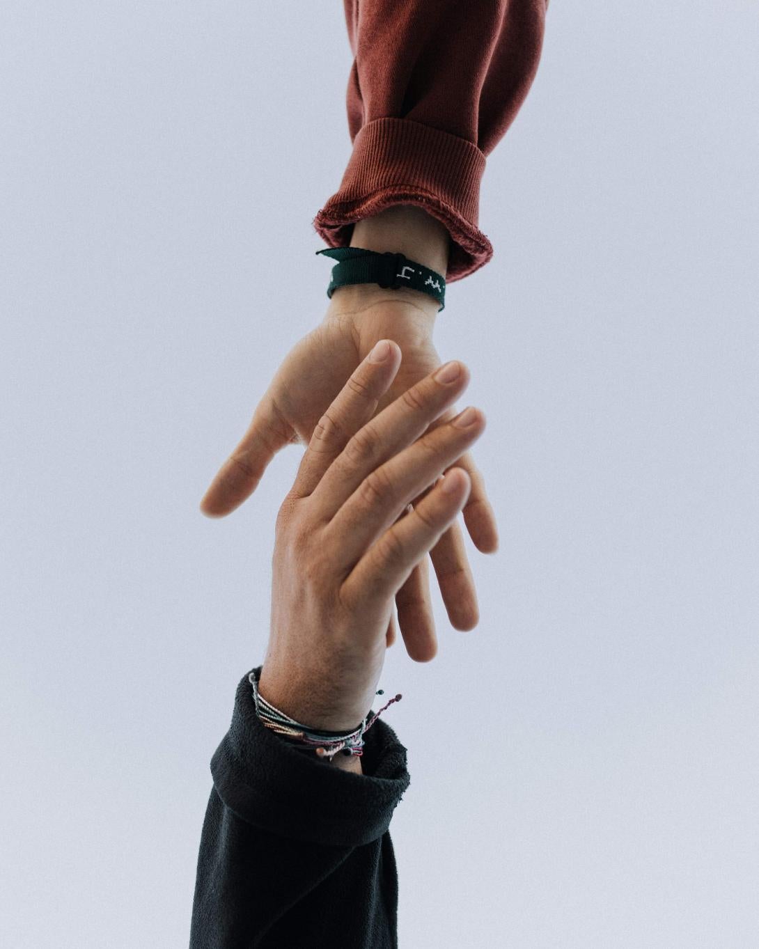 Stoch photo of people grabbing each other's hands